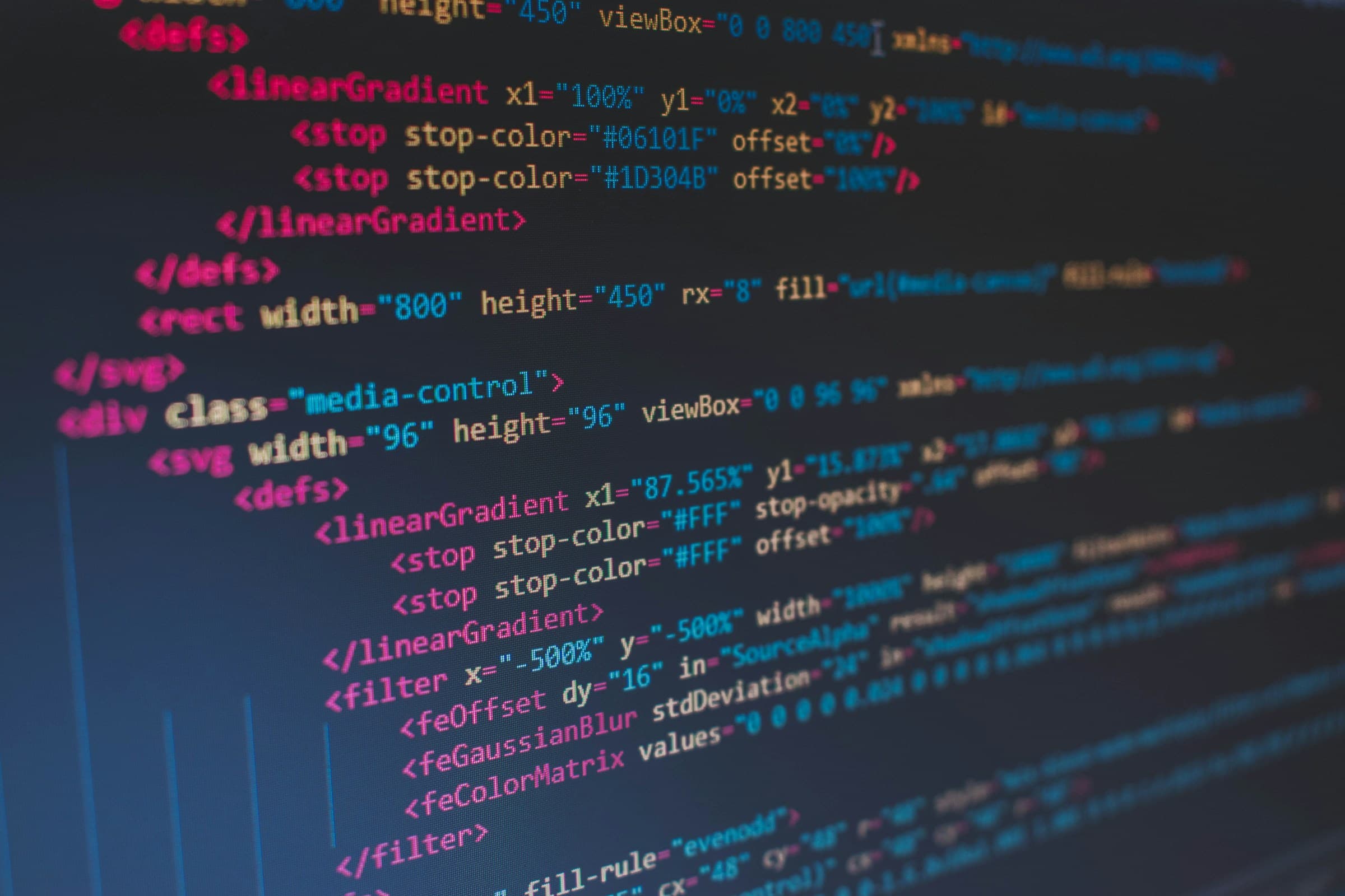 Close-up of source code on a dark screen, syntax-highlighted