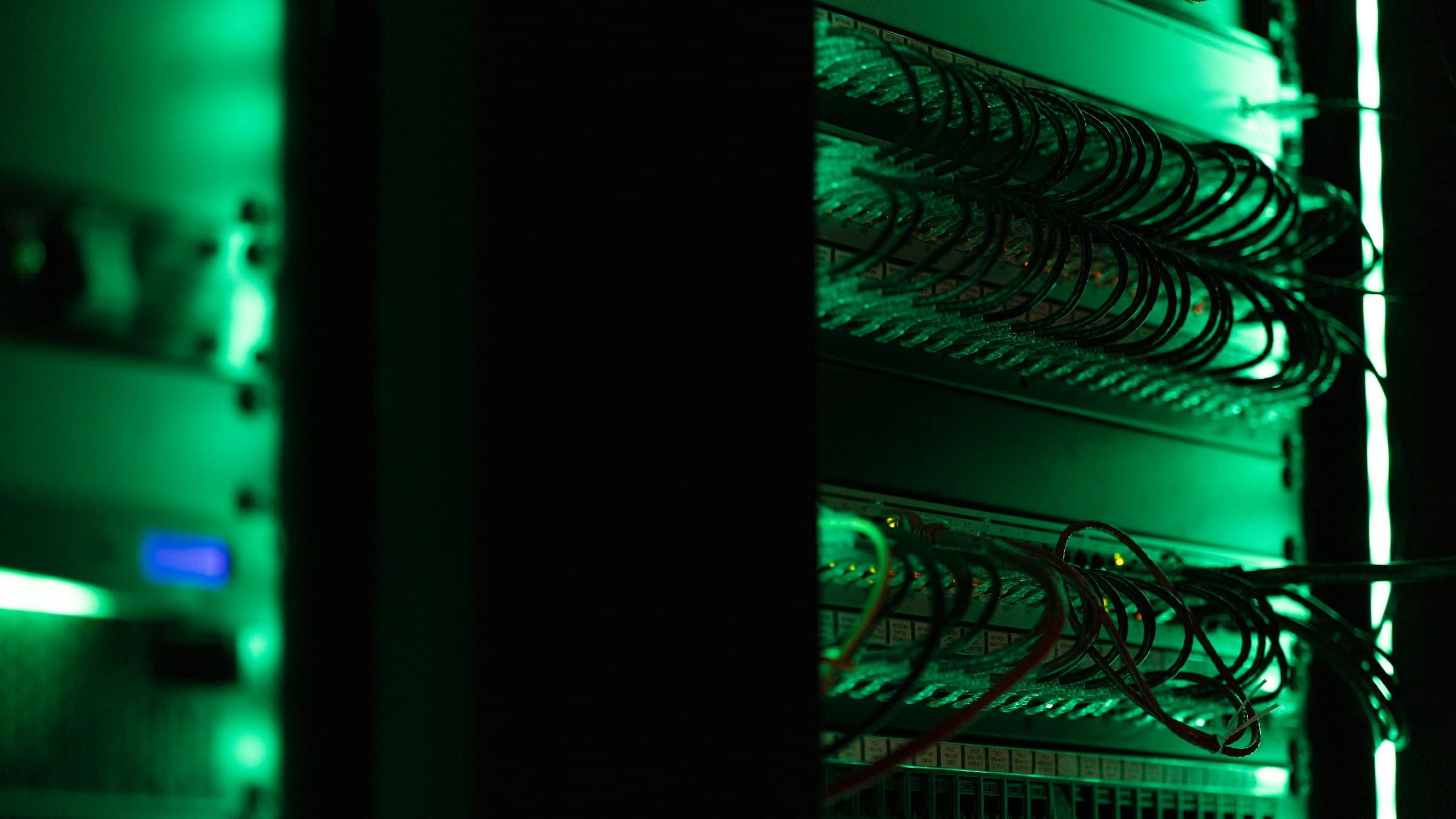 Wide angle of a high-density data center corridor