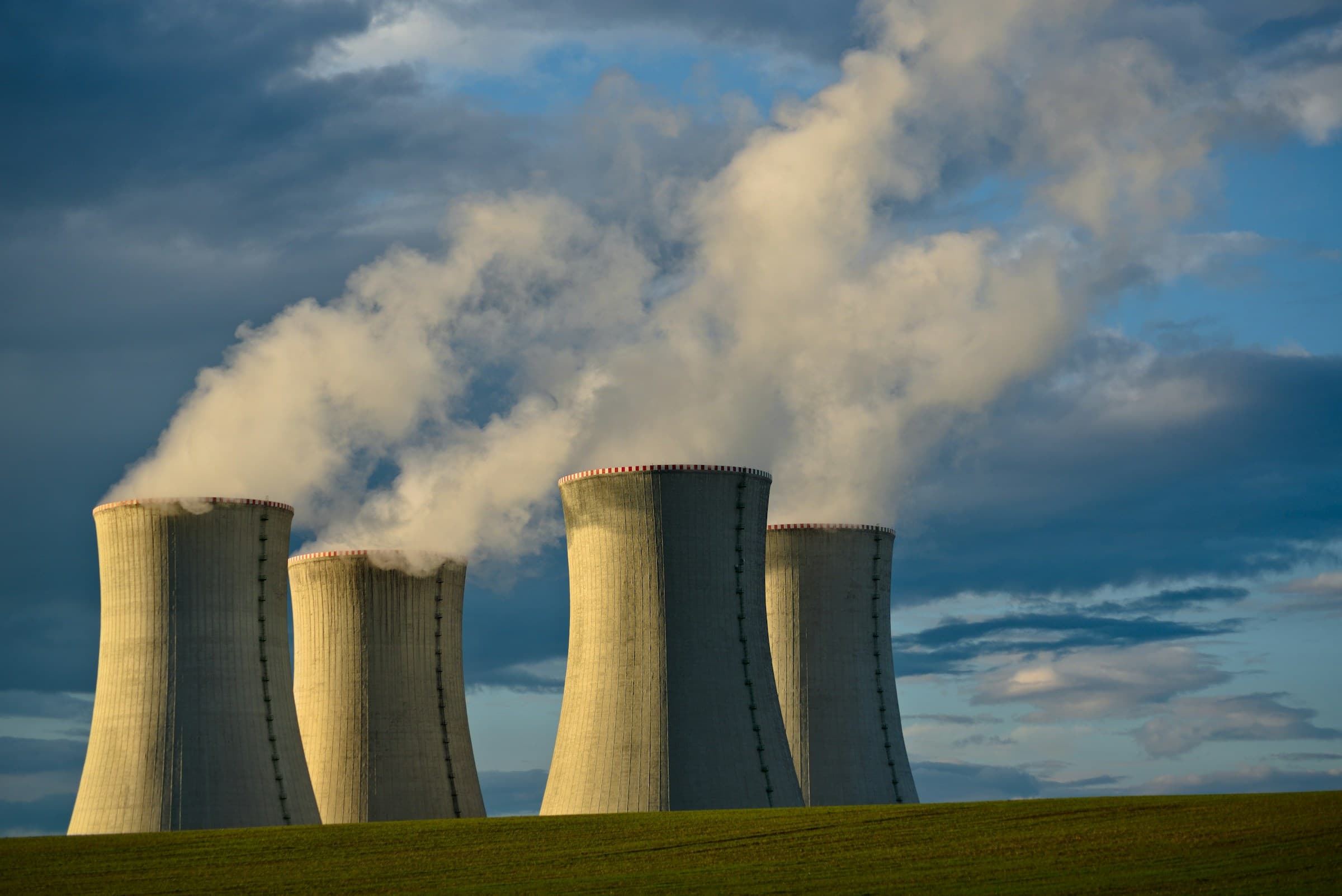 Cooling towers at nuclear power plant under overcast sky